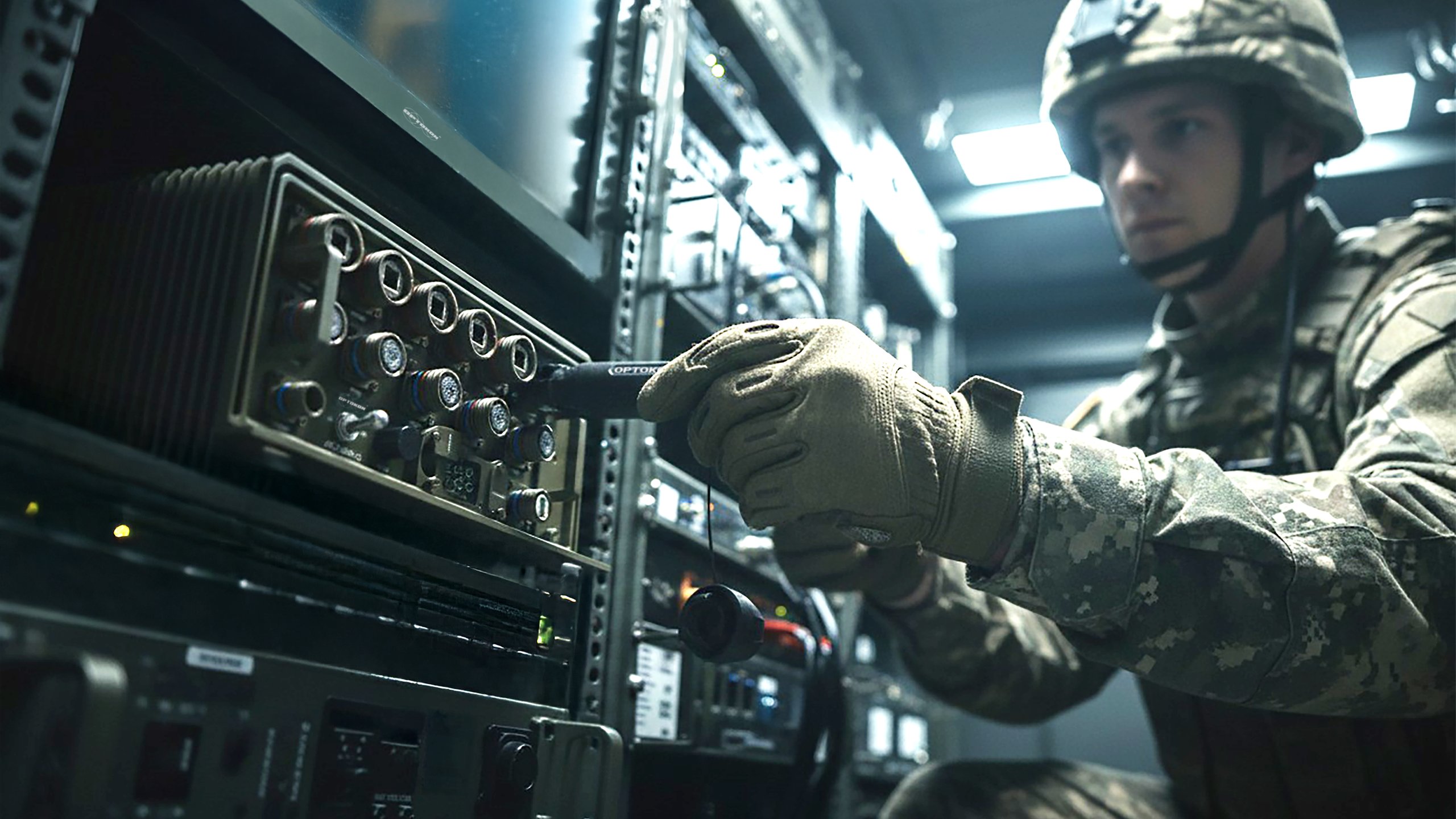 Soldier connecting Expanded Beam Connector to LMCP28H